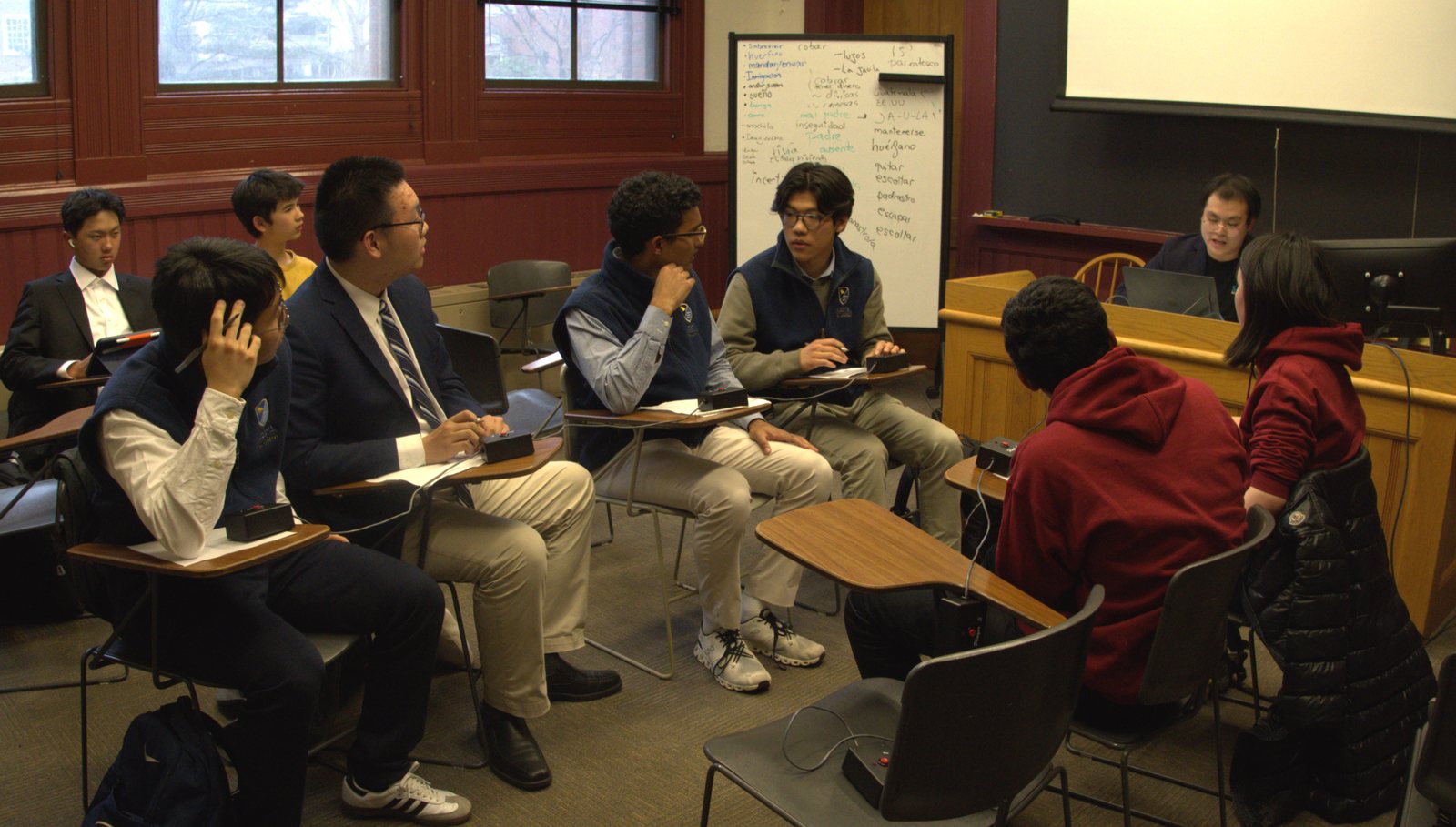 High-school students in an economics discussion at a Harvard session